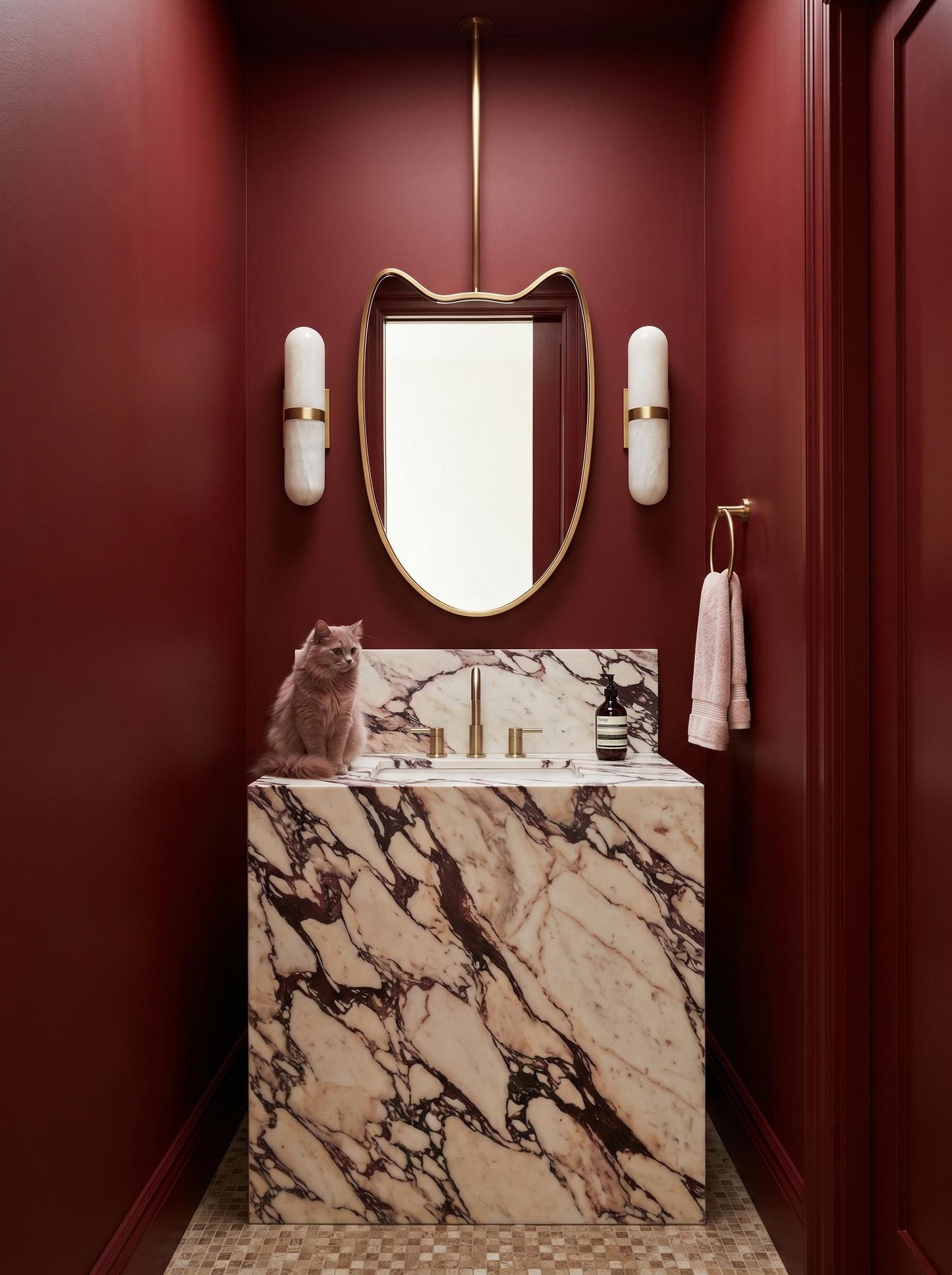 Ceiling-mounted brass mirror above marble vanity in elegant powder room