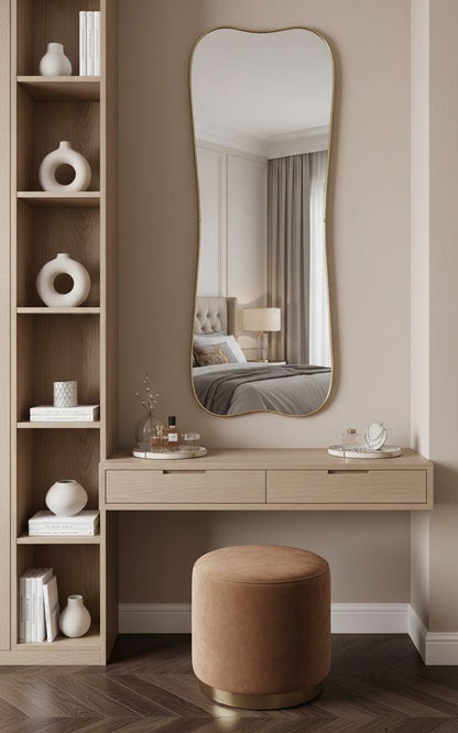 Wavy edge brass mirror in elegant bedroom vanity setup