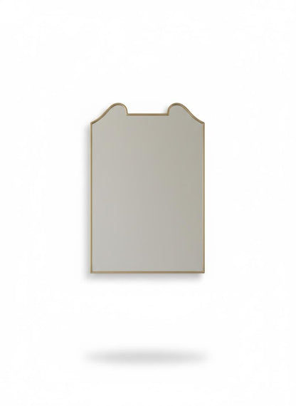 Rectangular curved top antique brass mirror in a white background