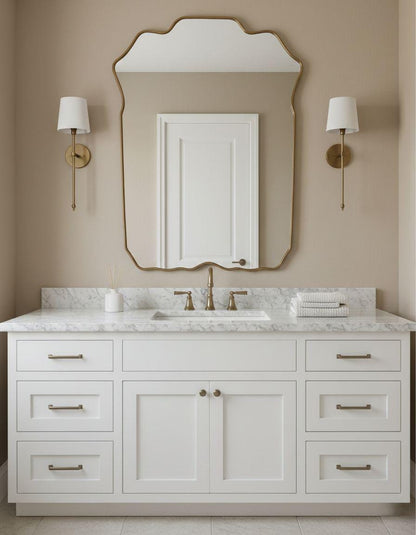 Curved scalloped brass vanity mirror in bathroom