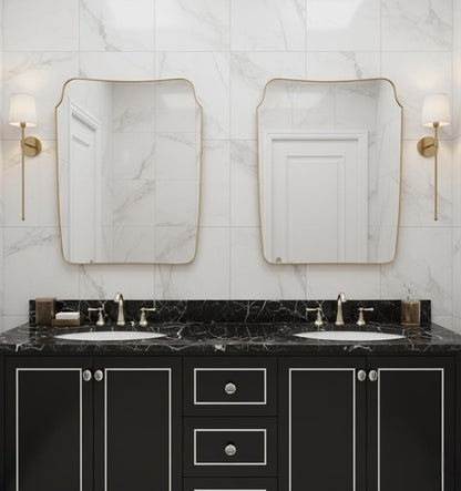 Irregular square brass mirror above double bathroom vanity