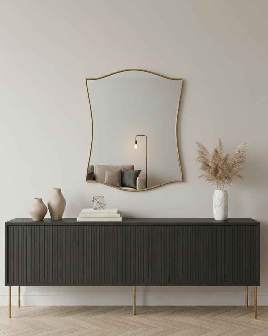 Curved scalloped brass mirror in modern living room