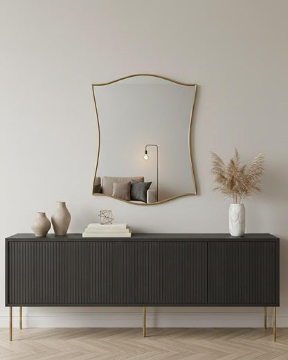 Curved scalloped brass mirror in modern living room