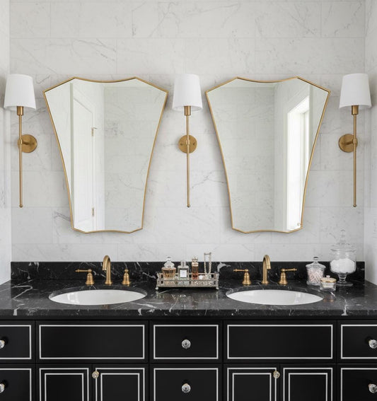 Pair of shield brass mirrors over double bathroom vanity