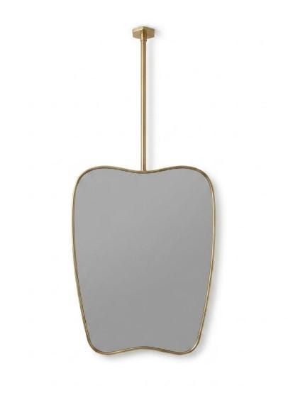 Freeform brass vanity mirror on white background