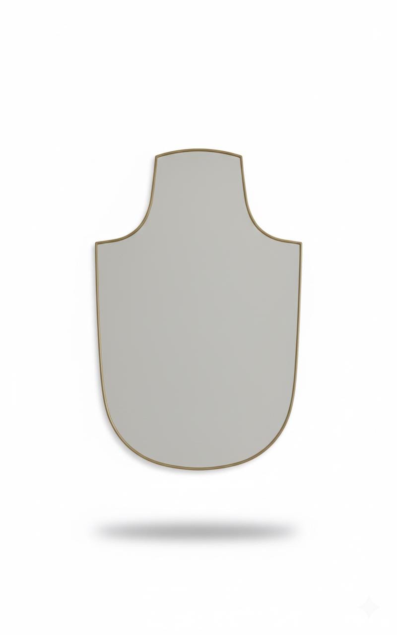 Shield brass mirror in a white background