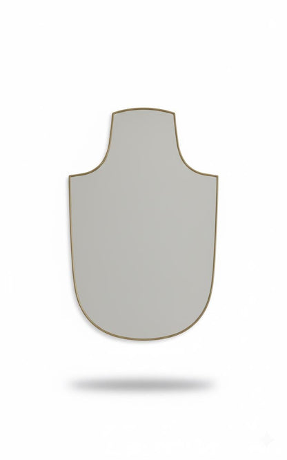 Shield brass mirror in a white background