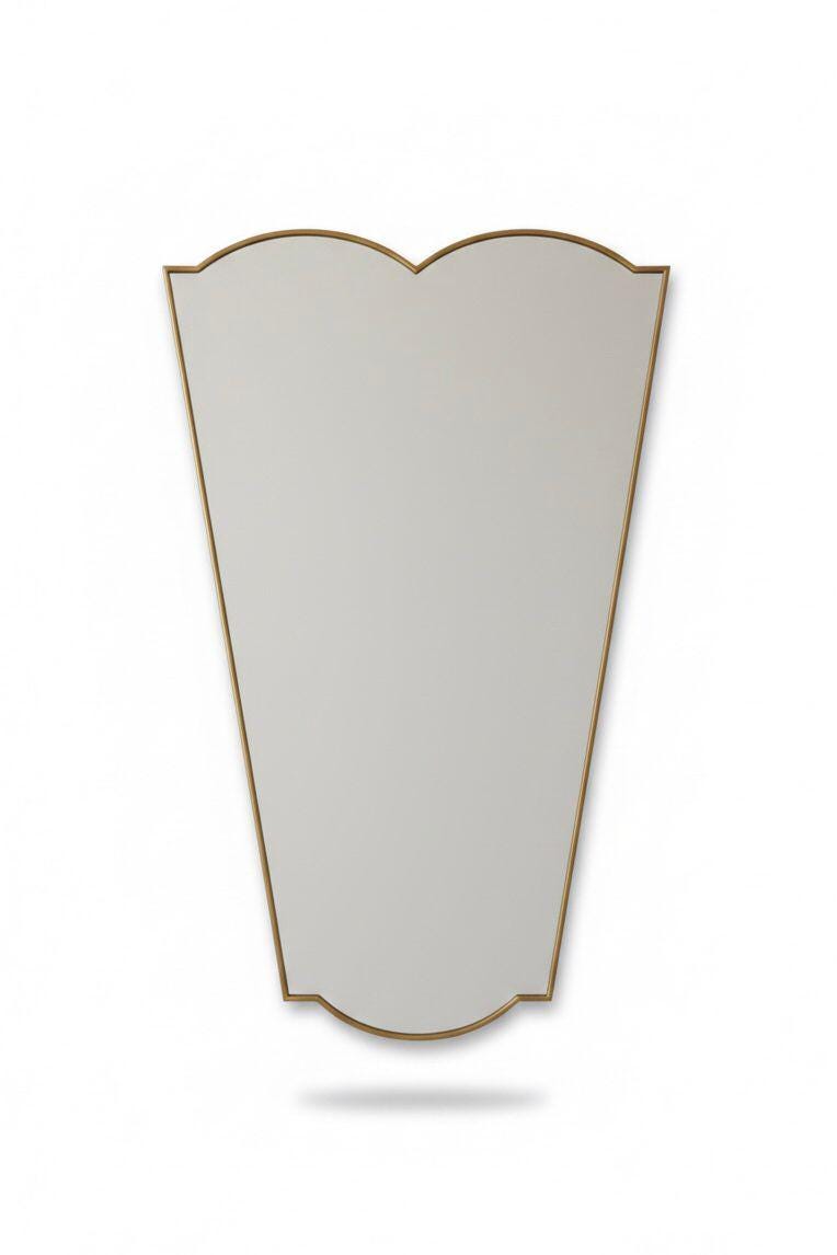 Tapered brass vanity mirror in a white background