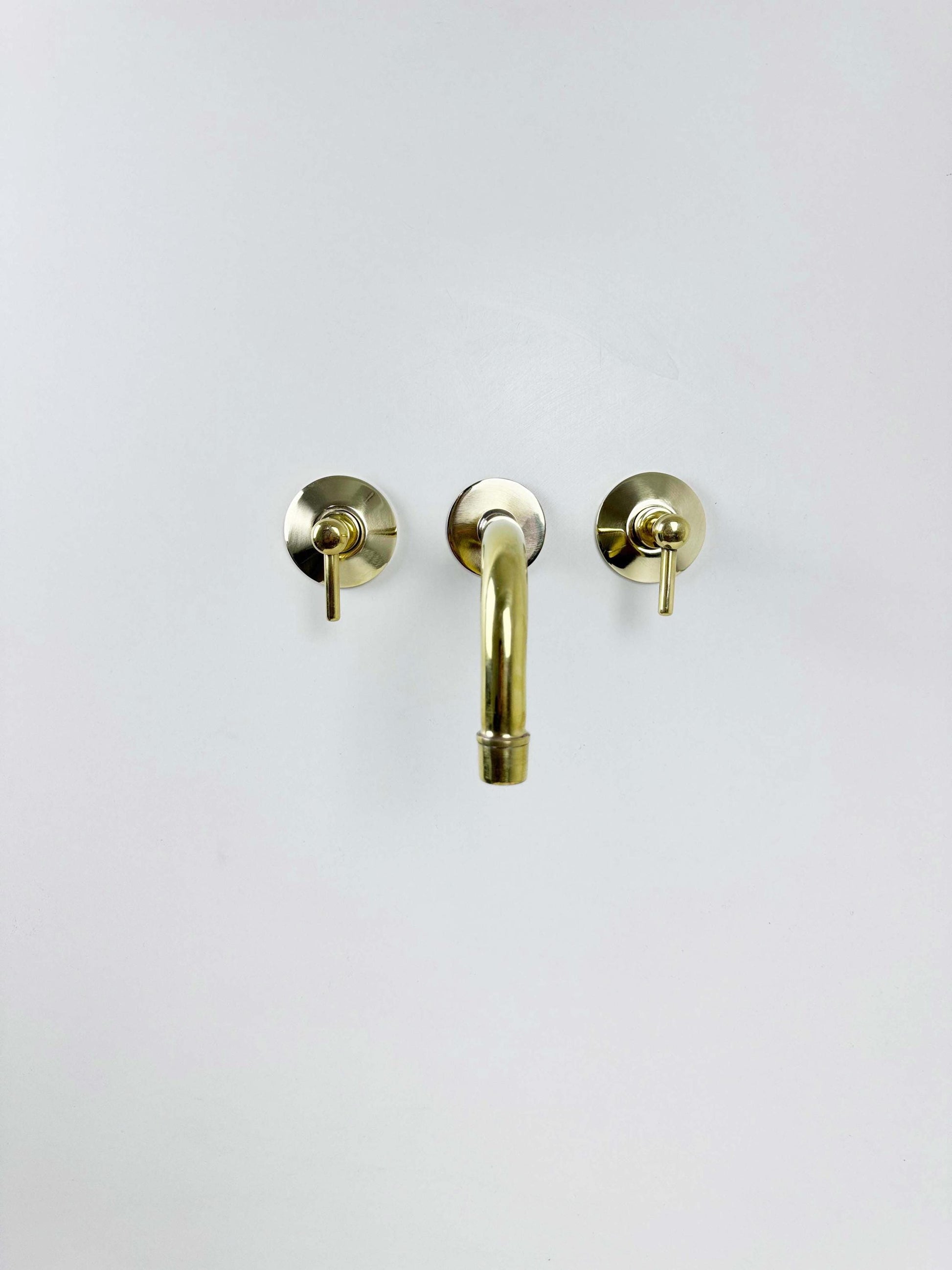 Unlacquered Brass Wall Mount Faucet on white background
