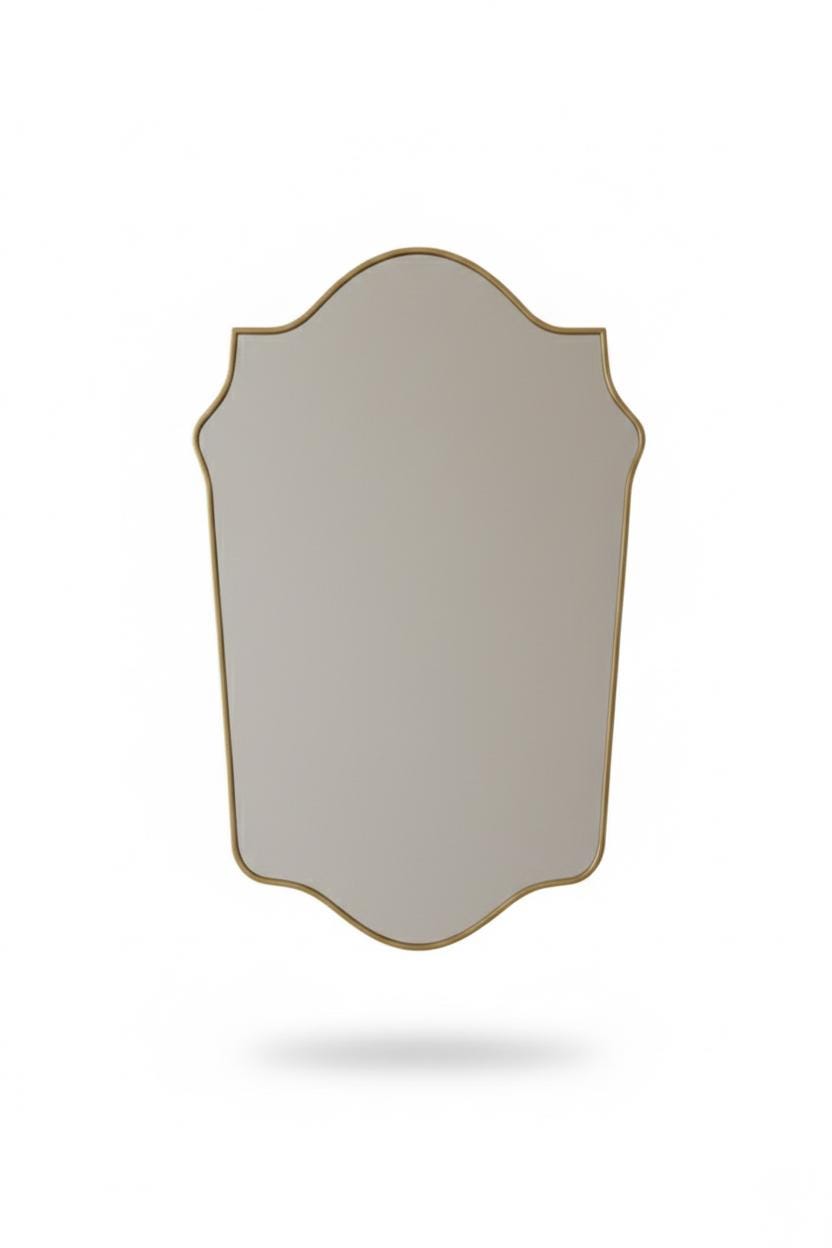 Arched crest brass mirror in a white background.