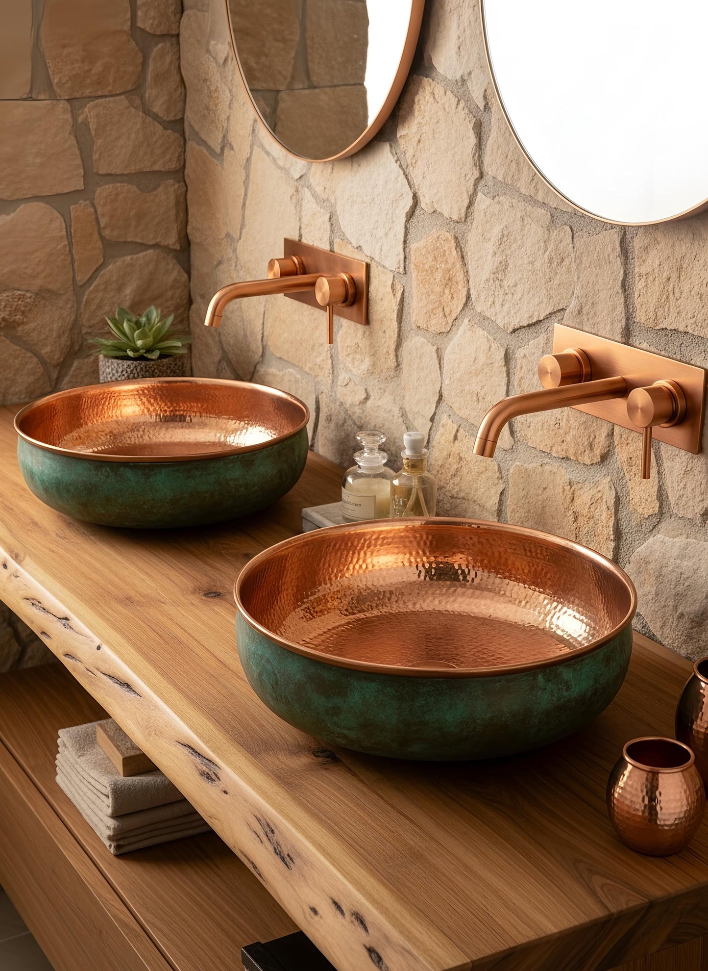 Handcrafted hammered copper sinks on modern bathroom vanity