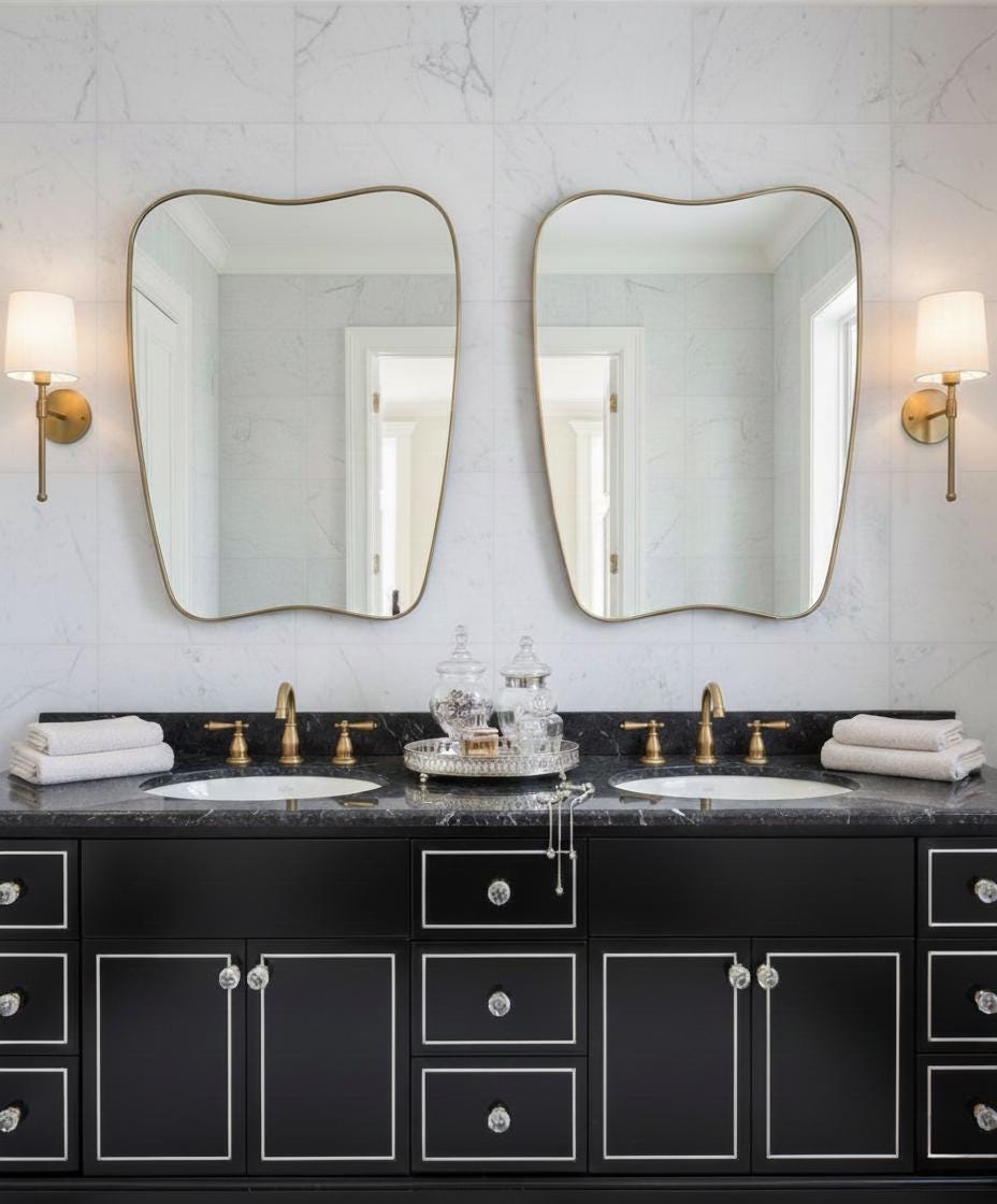 Modern irregular brass mirror in double sink bathroom