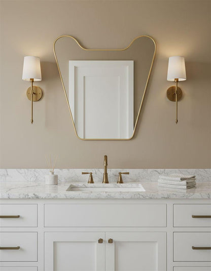 Organic brass vanity mirror with soft curved frame