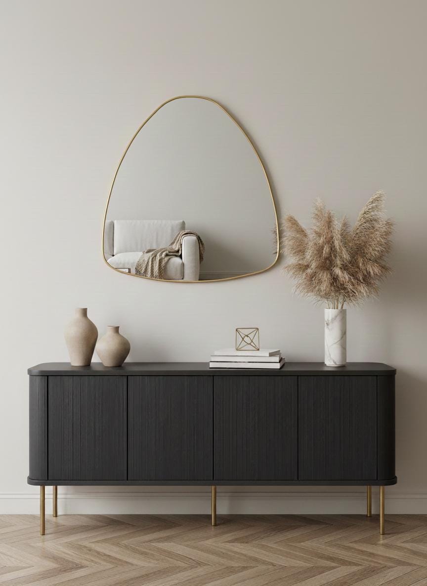 Curved handmade brass mirror in modern living room