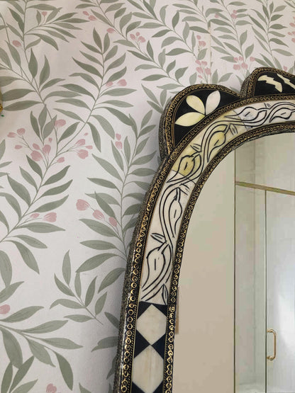 Side view of arched mirror bone inlay .