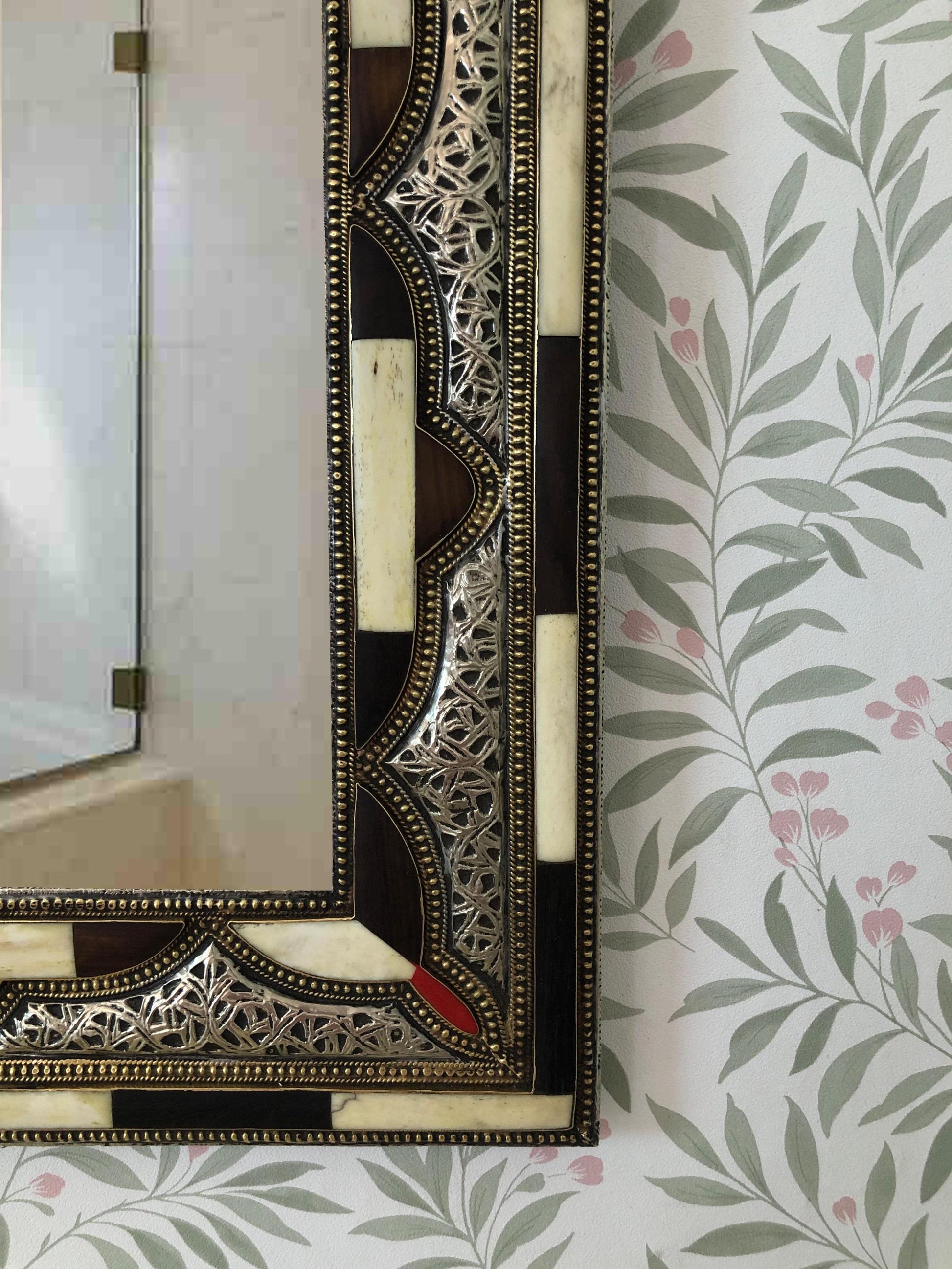 Angled view of the bone inlay mirror reflecting