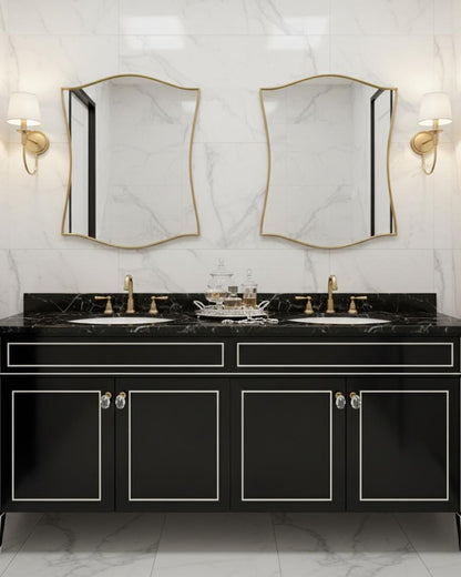 Pair of scalloped brass mirrors in luxury bathroom