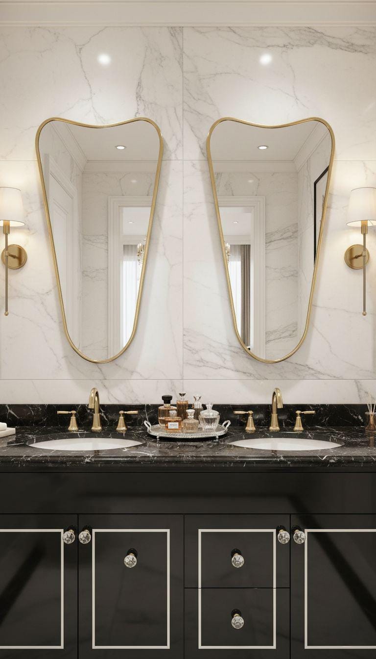 Asymmetrical tapered brass mirror above double bathroom vanity