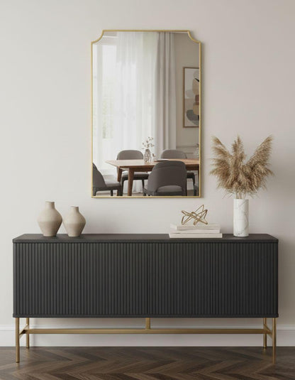 Rectangular scalloped brass mirror in modern entryway