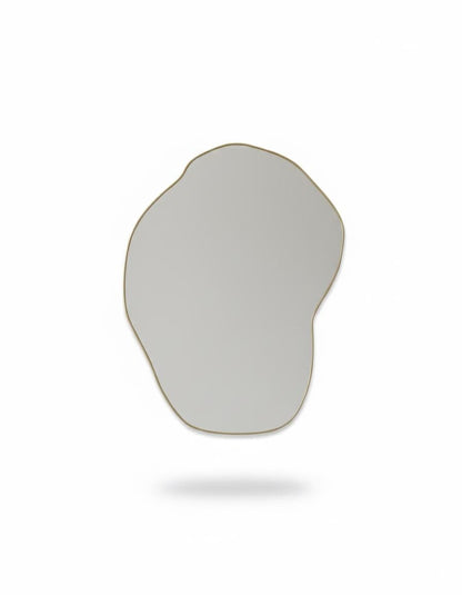 Handmade irregular brass mirror in a white background