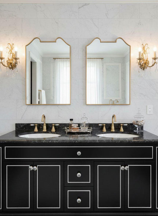 Double curved rectangular brass mirrors in classic bathroom