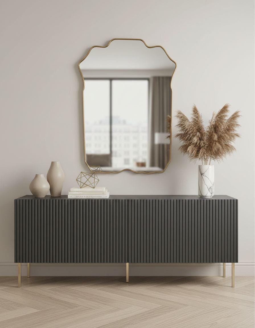 Handmade brass crest mirror above modern sideboard