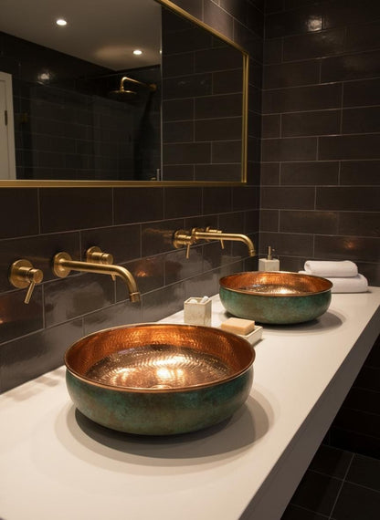 Double green patina copper vessel sinks with brass wall faucets