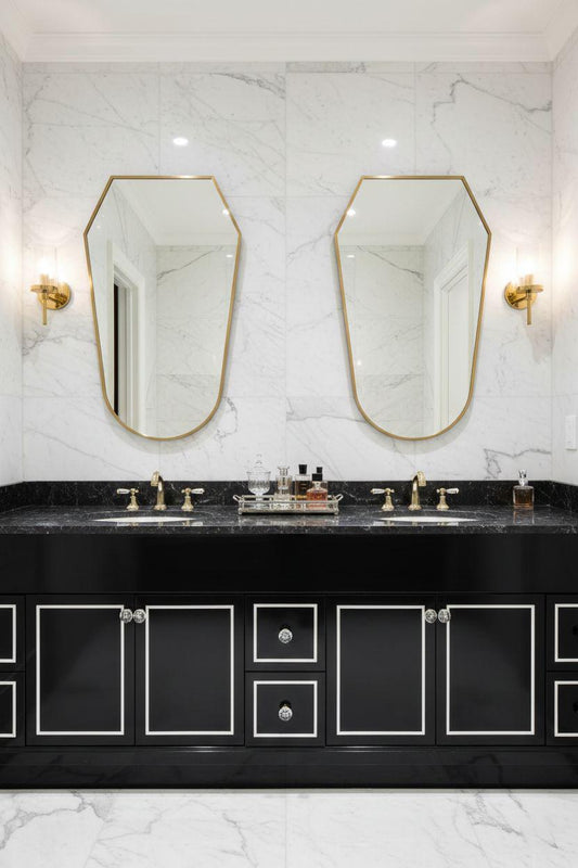 Double vanity bathroom with matching crest brass mirrors
