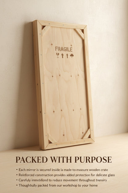 Reinforced wooden mirror crate marked “Fragile,” illustrating protective packaging for shipping.