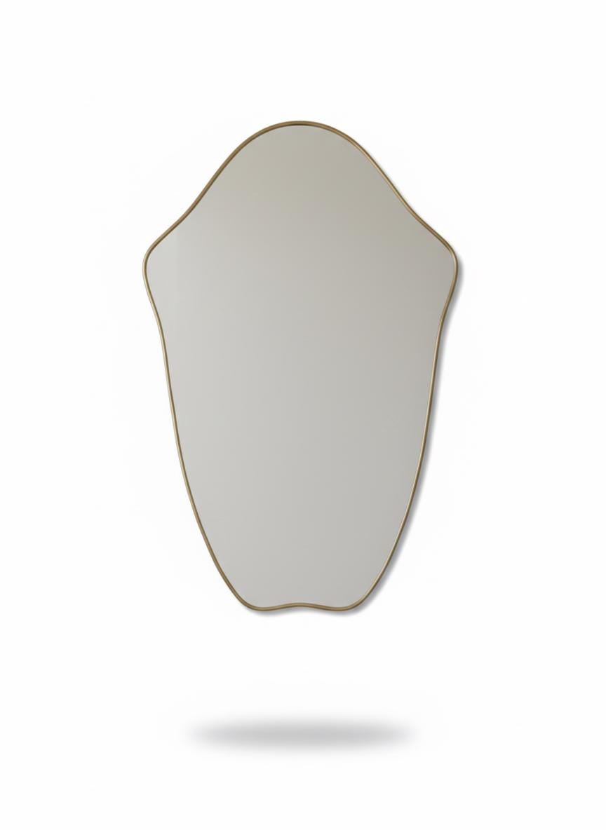 Irregular brass mirror in a white background