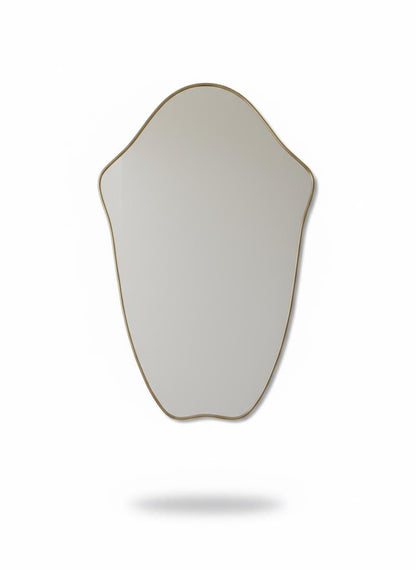 Irregular brass mirror in a white background