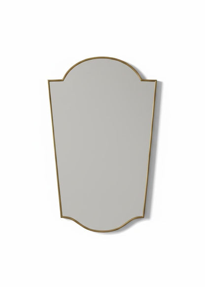 Close-up of modern shield brass mirror frame