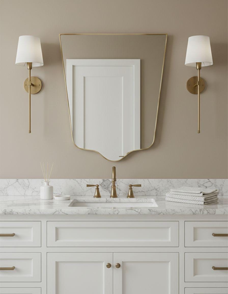 Shield gold bathroom mirror with wall sconces