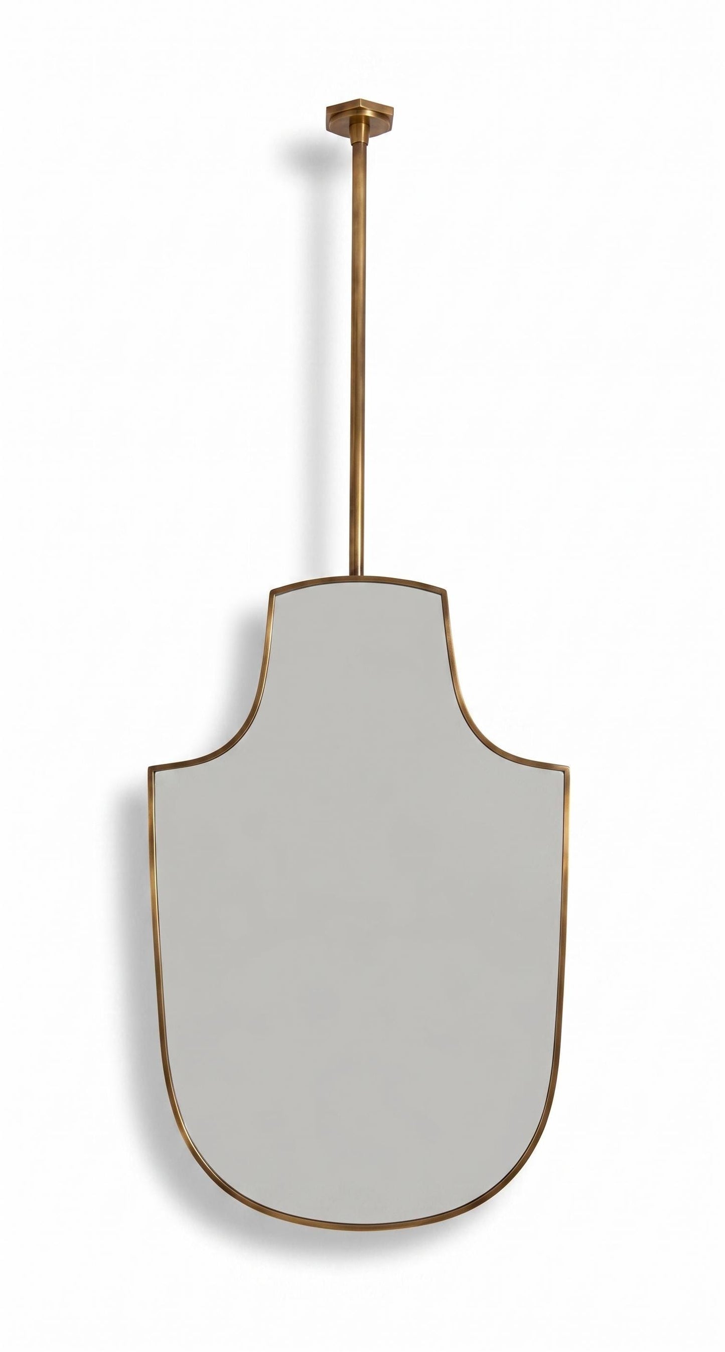 Handmade suspended shield brass mirror with slim unlacquered brass frame