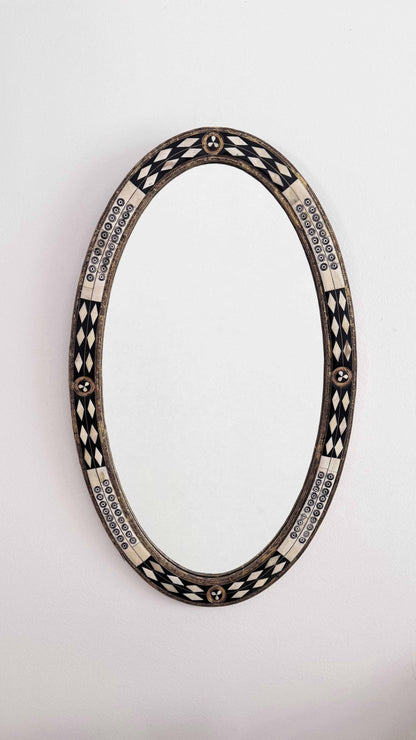 bone and brass frame oval mirror
