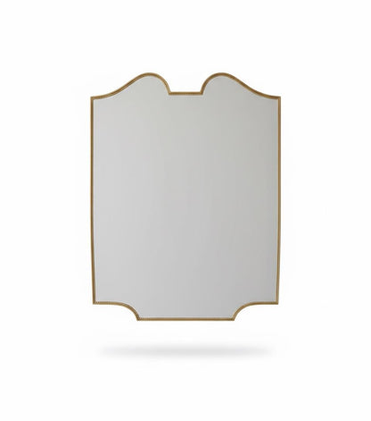 Scalloped brass mirror with curved frame in a white background.