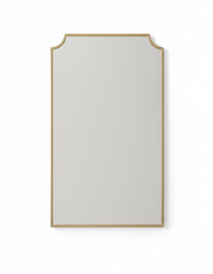 Scalloped brass mirror in a white background