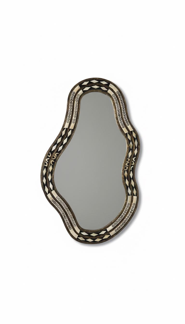Vertical handmade bone mirror on neutral background