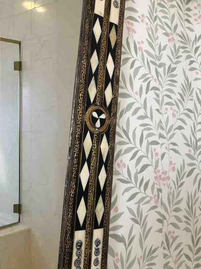 Close-up of bone inlay mirror frame detail.