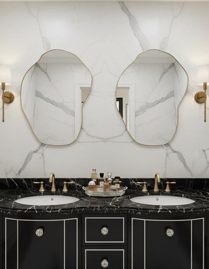 Pair of organic brass mirrors over double sink bathroom vanity