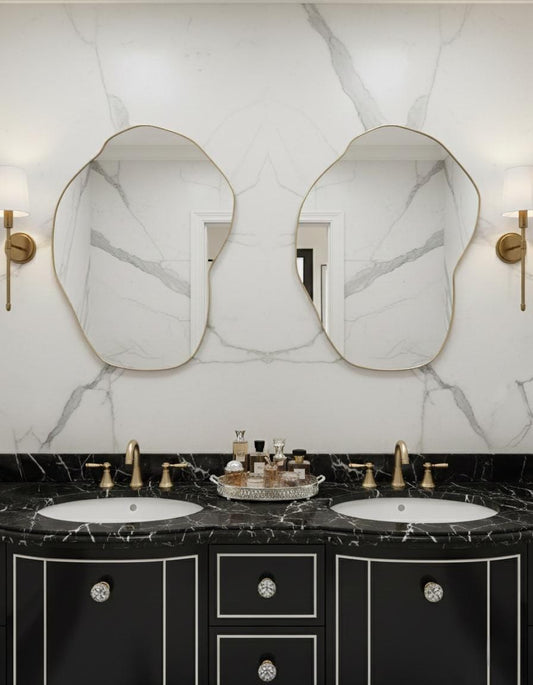 Pair of organic brass mirrors over double sink bathroom vanity
