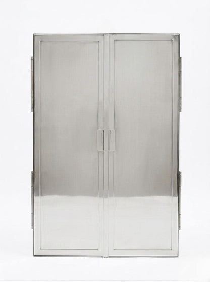 Closed polished silver trifold bathroom mirror.