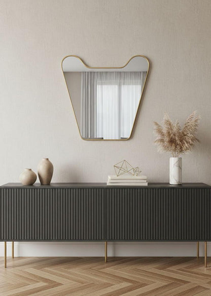 Curved handmade brass wall mirror in modern living room