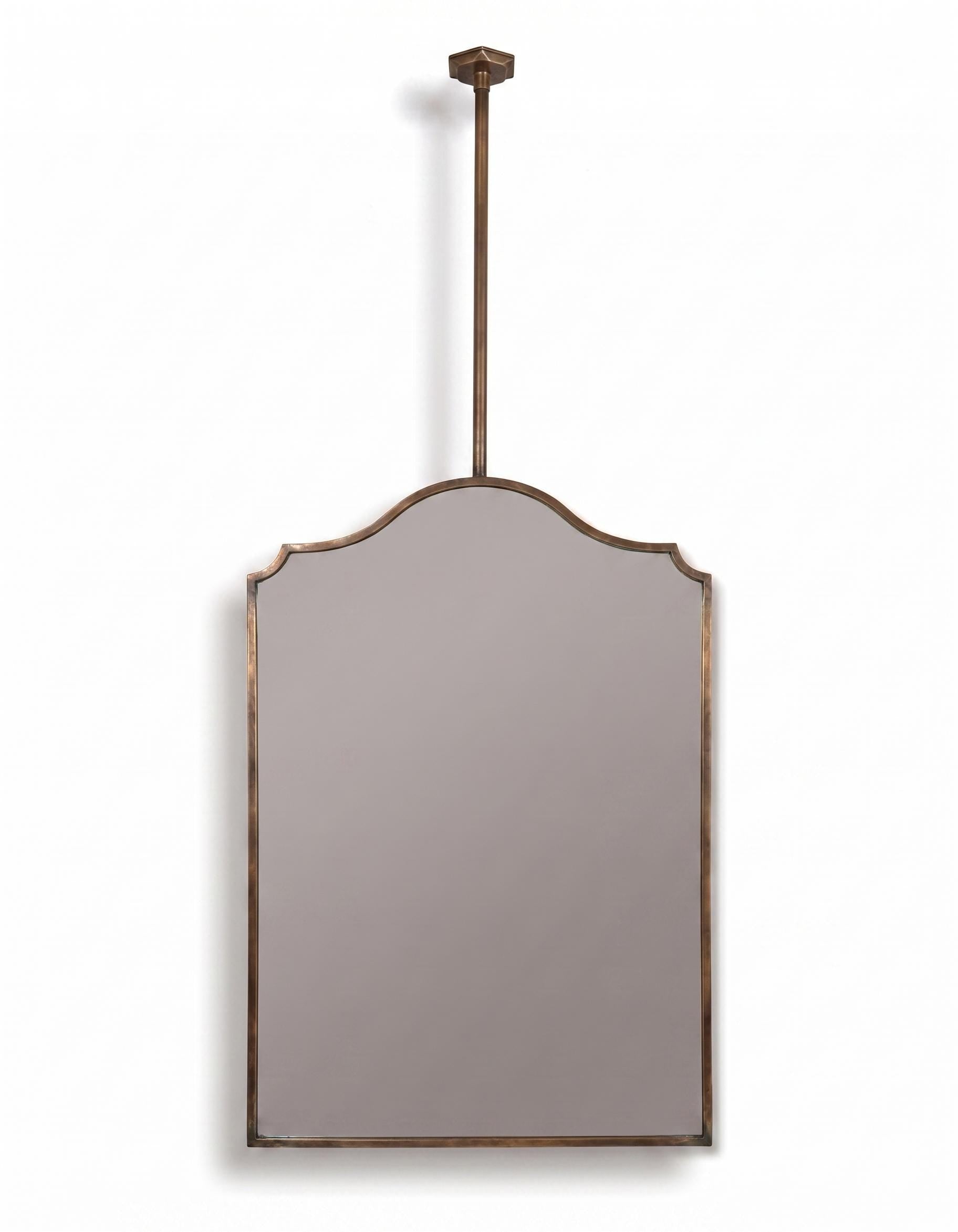 Suspended scalloped brass mirror with dimension guide