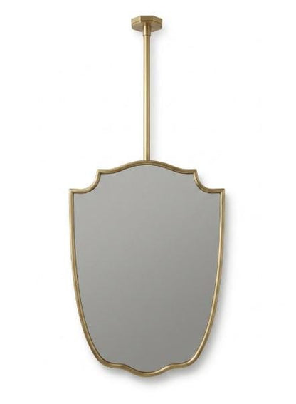 Handcrafted suspended brass mirror with elegant curved frame on a neutral background.
