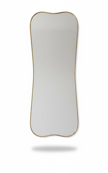 Wavy edge vanity mirror in a white background