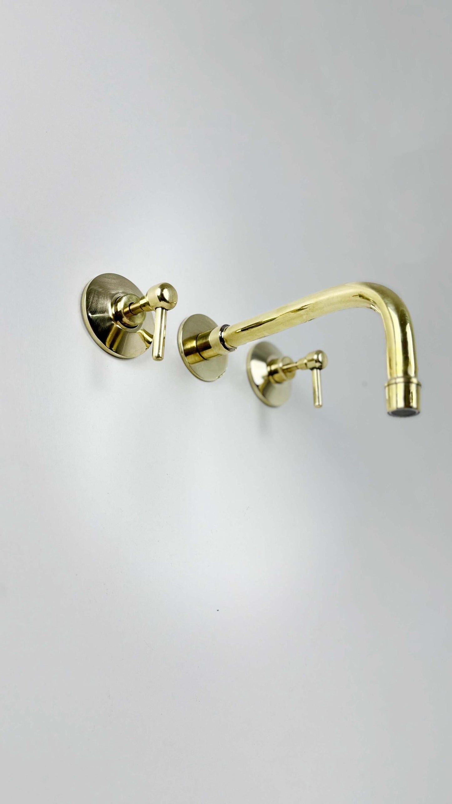 Unlacquered Brass Wall Mount Faucet on white background
