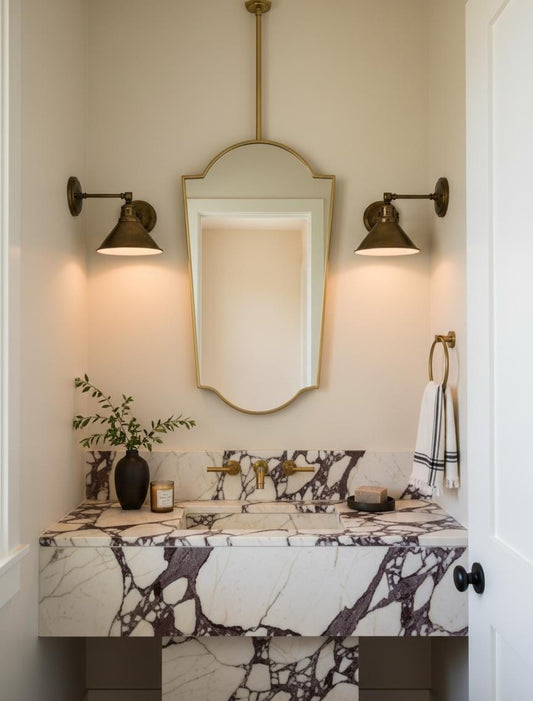 Brass shield mirror in red bathroom