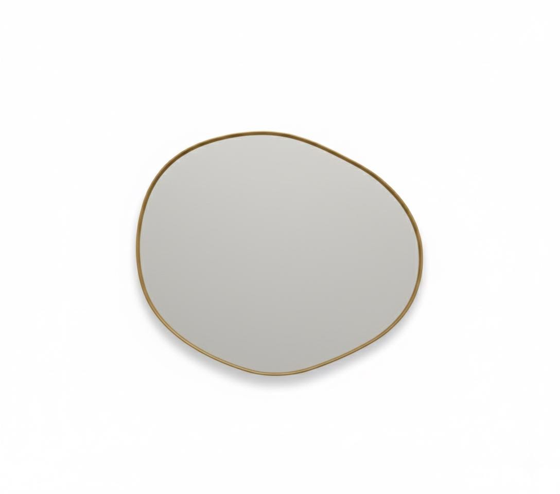 Asymmetrical brass mirror  a white background.