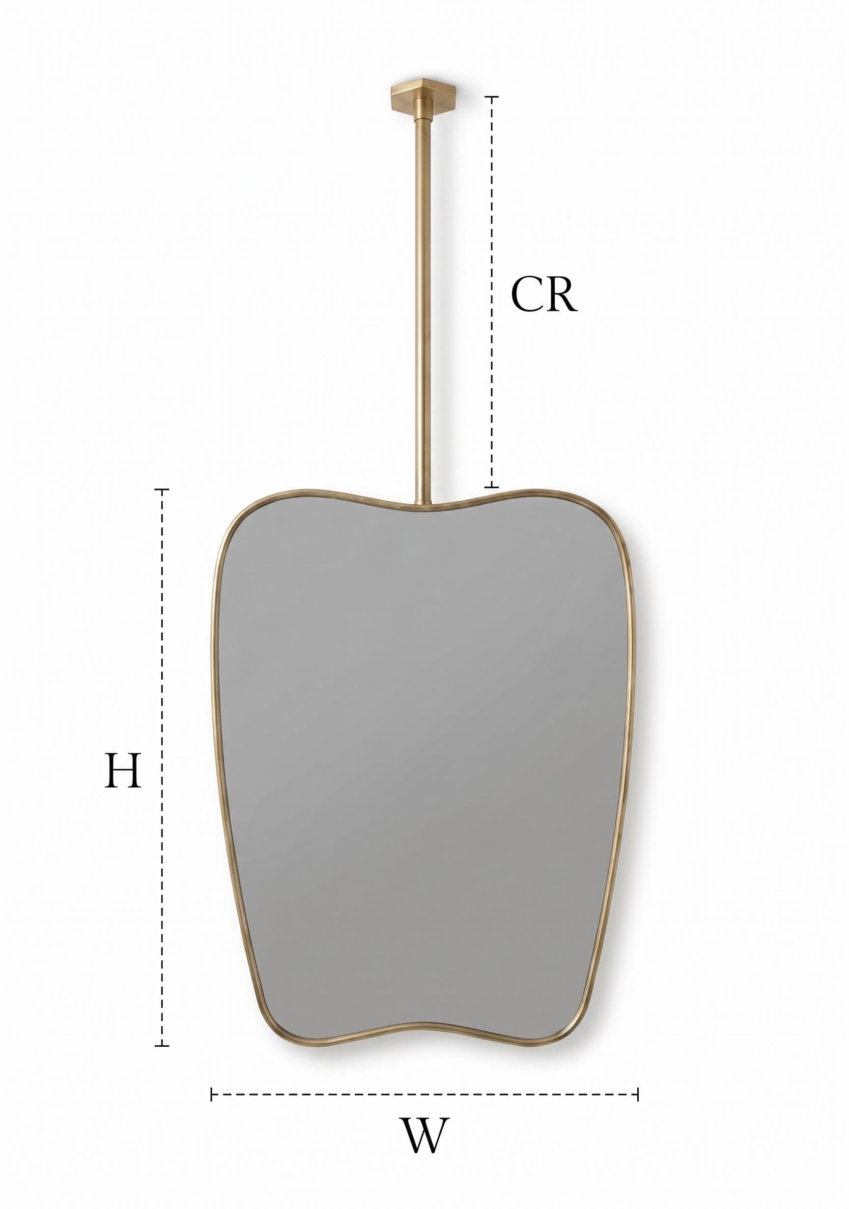 Suspended organic brass mirror with dimension guide and ceiling rod measurements